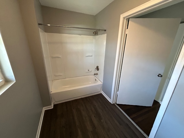 bathroom featuring bathing tub / shower combination and wood-type flooring