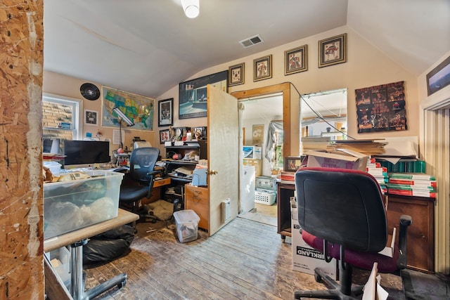 office with wood-type flooring and vaulted ceiling