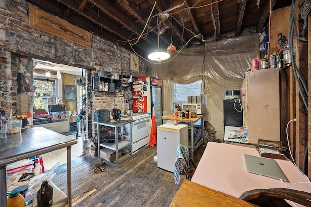 interior space with dark hardwood / wood-style flooring and white stove