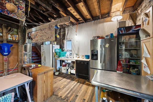 interior space with dishwasher, stainless steel fridge, wood-type flooring, and white refrigerator