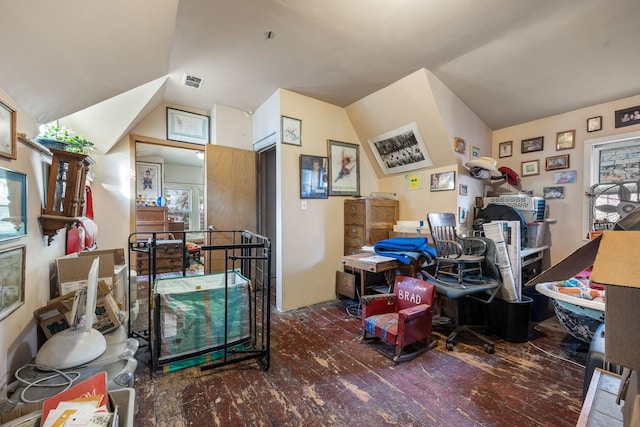 interior space with dark hardwood / wood-style floors and vaulted ceiling