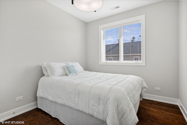 bedroom featuring dark wood-type flooring