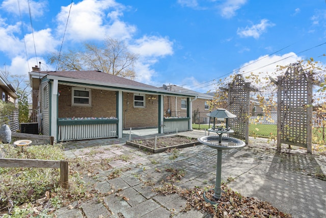 back of property featuring a patio