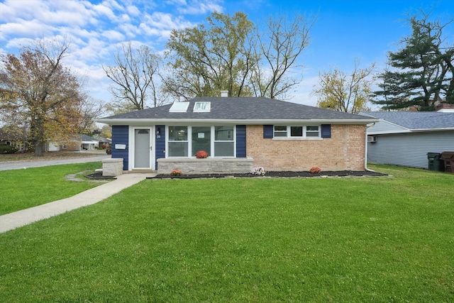 ranch-style home with a front lawn