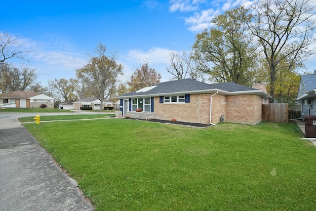 view of side of home with a yard