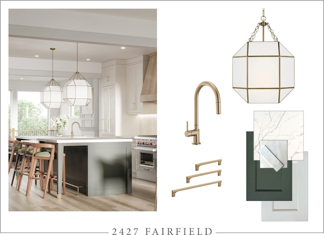 kitchen featuring pendant lighting, a kitchen bar, stainless steel range, wall chimney range hood, and white cabinetry