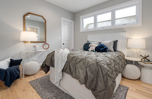 bedroom featuring wood finished floors