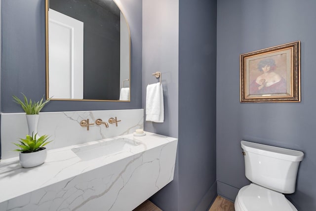 bathroom featuring toilet and a sink