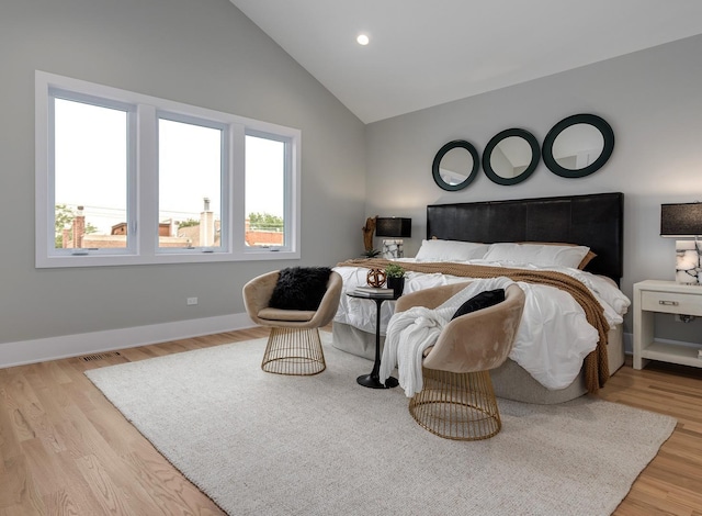 bedroom with recessed lighting, wood finished floors, visible vents, and baseboards