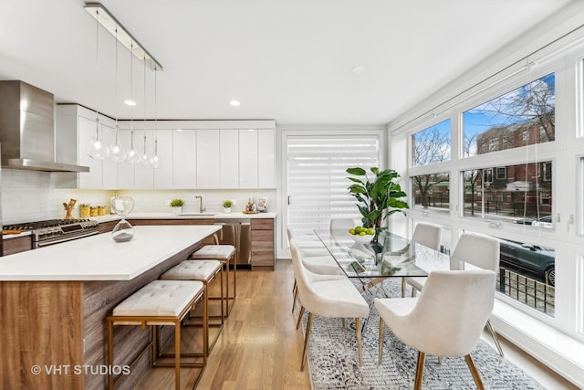 dining room featuring light hardwood / wood-style floors and sink