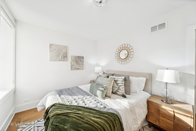 bedroom featuring wood-type flooring