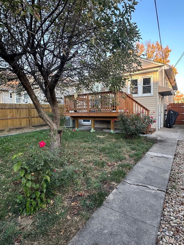 exterior space with a lawn and a wooden deck