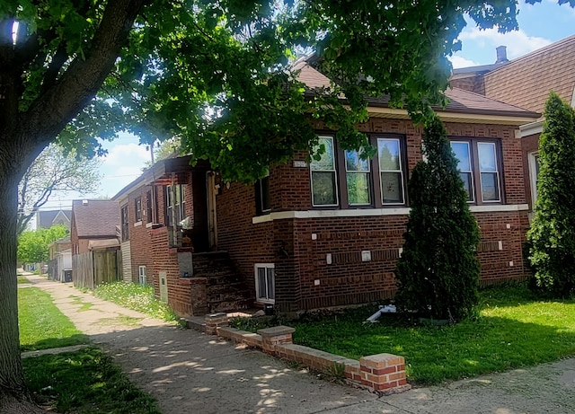 view of side of property featuring a yard