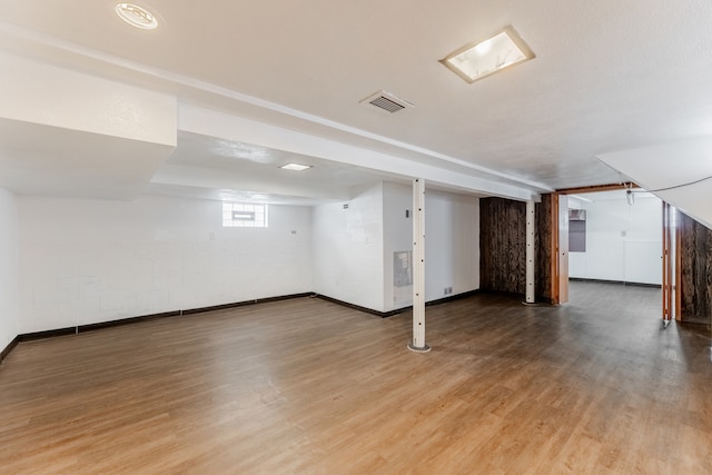 basement featuring wood-type flooring