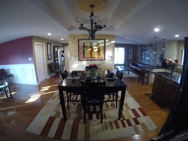 dining room featuring an inviting chandelier and hardwood / wood-style flooring