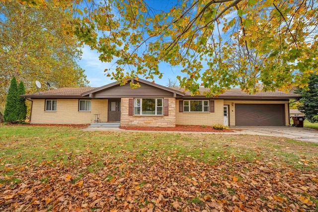 ranch-style home featuring a front lawn and a garage