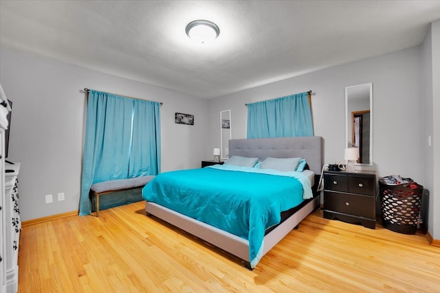 bedroom with hardwood / wood-style floors