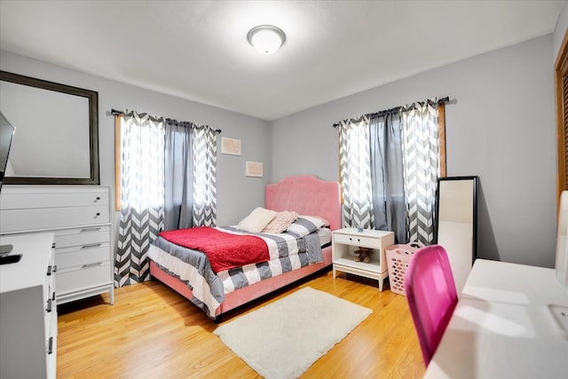 bedroom with light hardwood / wood-style flooring