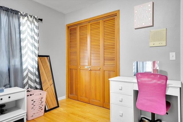 office area with light hardwood / wood-style flooring