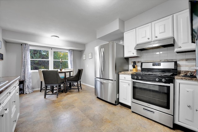 kitchen featuring stainless steel appliances, white cabinetry, and decorative backsplash