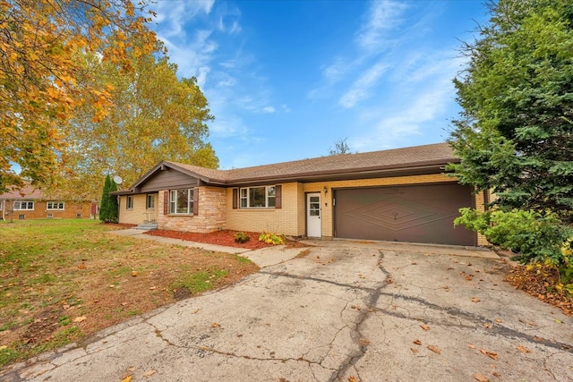 ranch-style home with a garage and a front yard