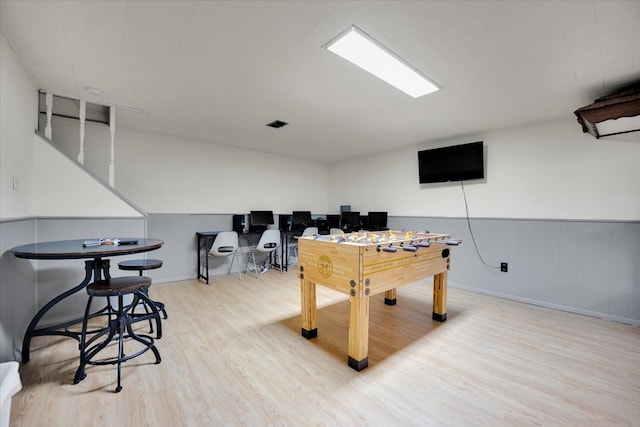 playroom with light hardwood / wood-style flooring