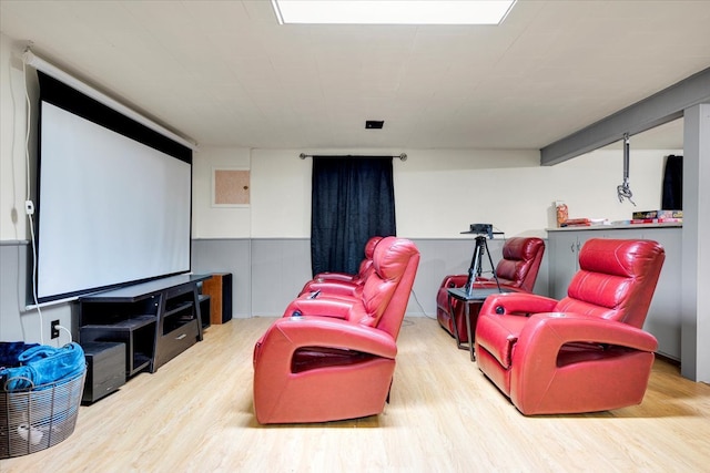 home theater with light hardwood / wood-style flooring