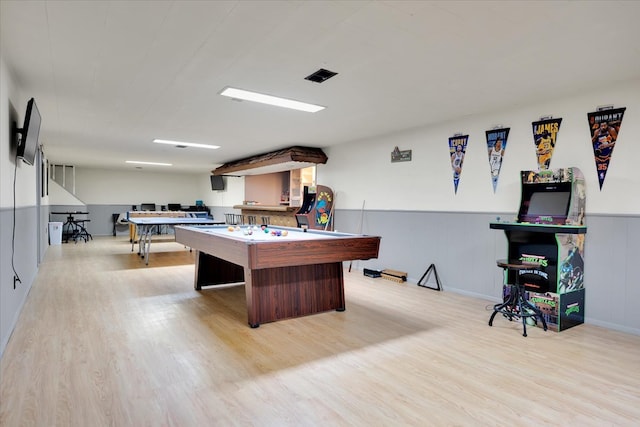 game room with pool table and light hardwood / wood-style flooring