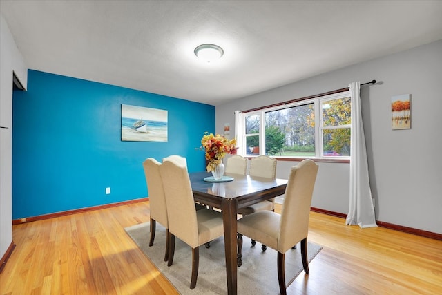 dining room with light wood-type flooring