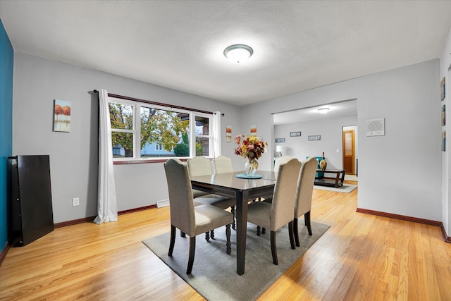 dining room featuring light hardwood / wood-style flooring