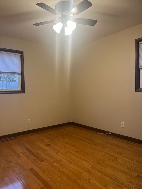 empty room featuring light hardwood / wood-style flooring and ceiling fan