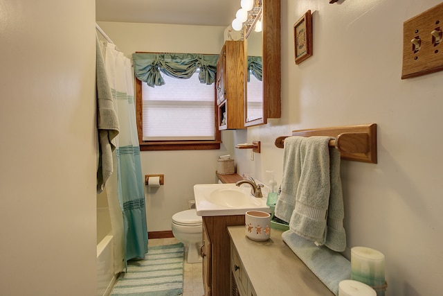 full bathroom featuring toilet, vanity, tile patterned floors, and shower / bathtub combination with curtain