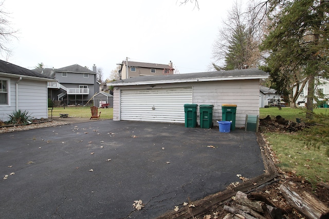 view of property exterior featuring an outbuilding and a garage