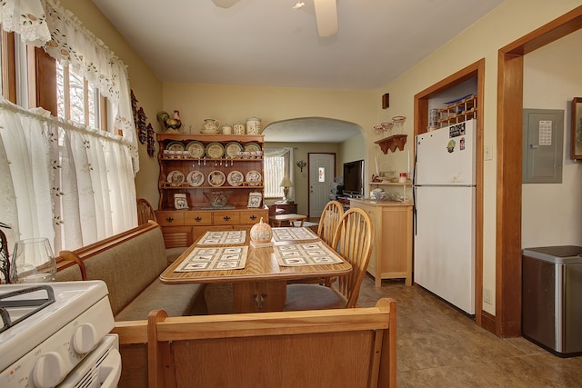 dining room with electric panel and ceiling fan