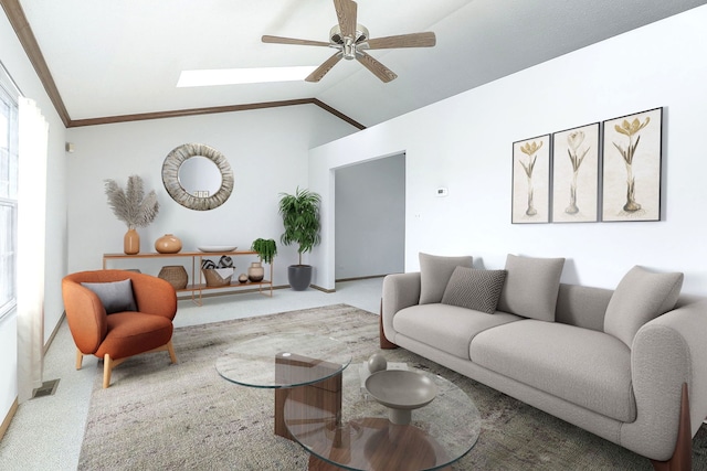 living room with ceiling fan, carpet flooring, lofted ceiling with skylight, and ornamental molding