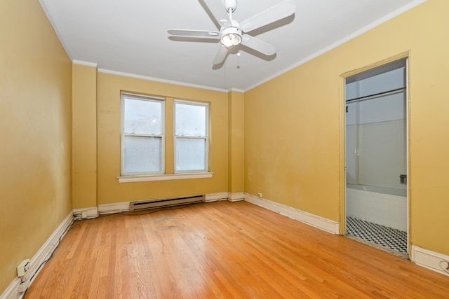 empty room with ceiling fan, ornamental molding, a baseboard heating unit, and light wood-type flooring