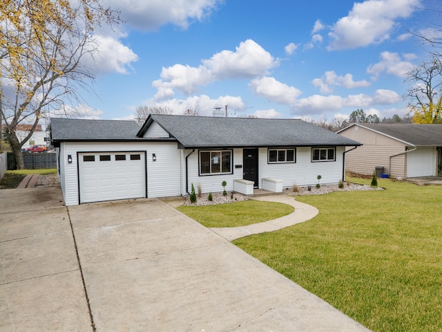 ranch-style home featuring a front lawn and a garage