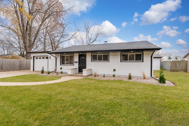 ranch-style home with a garage and a front yard