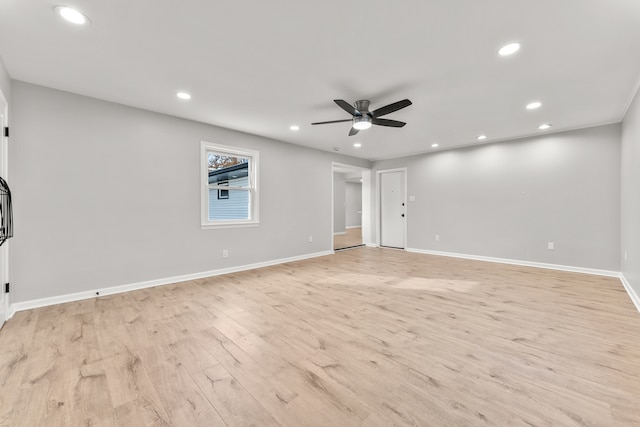 unfurnished room featuring light hardwood / wood-style floors and ceiling fan