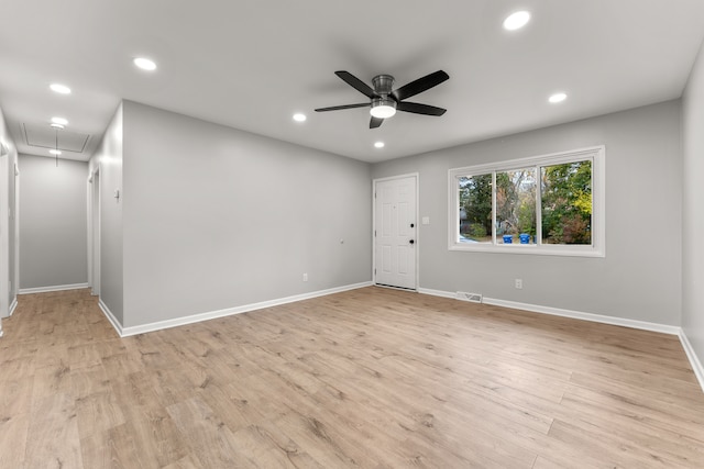 spare room featuring ceiling fan and light hardwood / wood-style floors