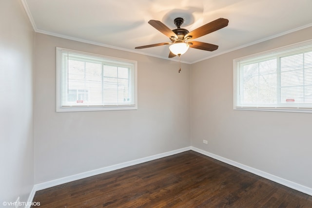 spare room with dark hardwood / wood-style flooring, ceiling fan, and crown molding