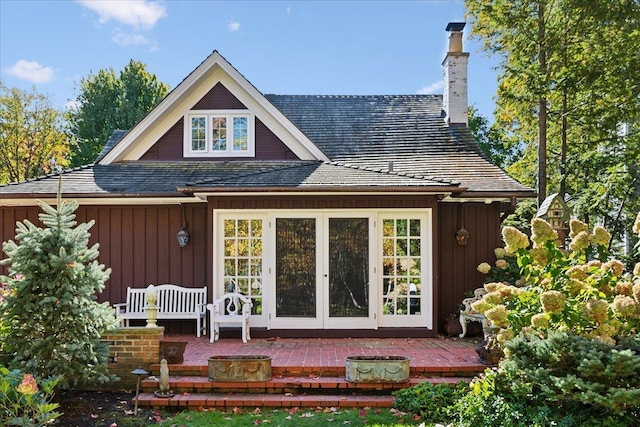 rear view of property featuring french doors