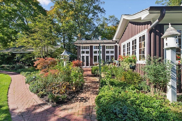 rear view of property with french doors