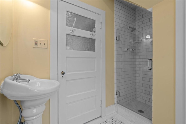 bathroom with a shower with shower door