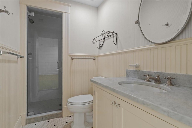 bathroom featuring toilet, walk in shower, tile patterned floors, wood walls, and vanity