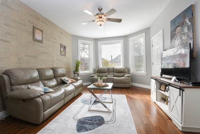 living room featuring hardwood / wood-style flooring and ceiling fan