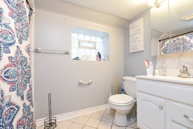 bathroom featuring tile patterned floors, vanity, and toilet