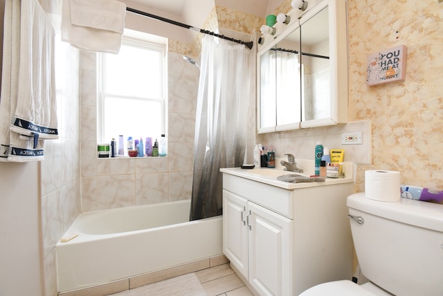 full bathroom with tile patterned floors, vanity, toilet, and shower / bath combo