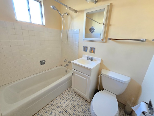 full bathroom with vanity, tile patterned floors, toilet, and tiled shower / bath