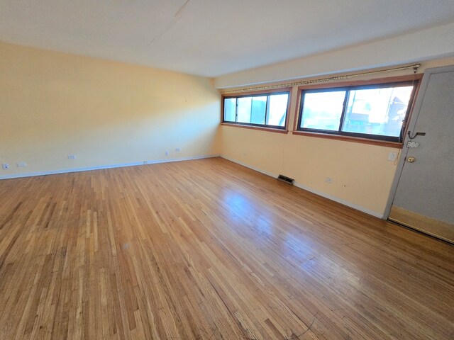 spare room featuring light hardwood / wood-style flooring